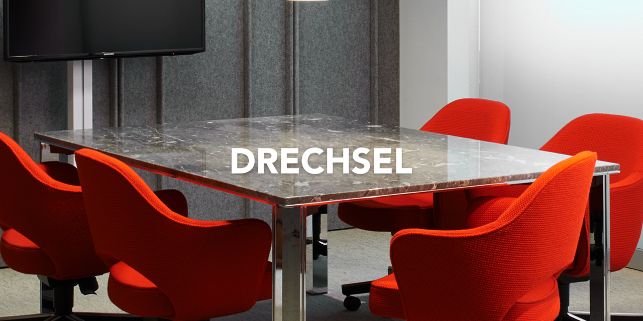 Marble conference table with orange chairs
